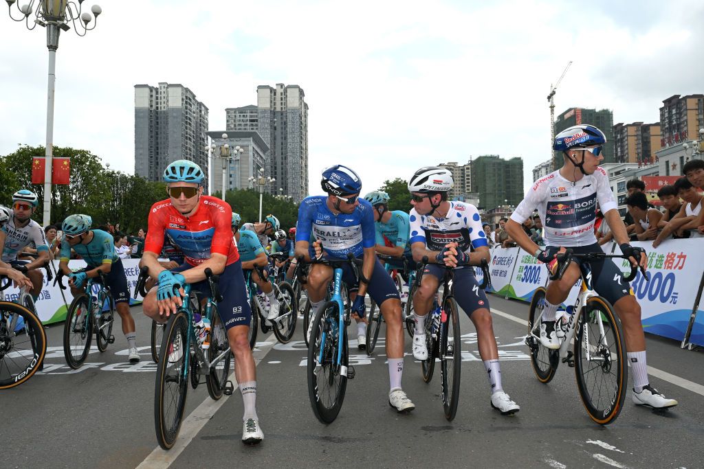 YIZHOU CHINA OCTOBER 19 LR Max Kanter of Germany and Astana Qazaqstan Team Red Leader Jersey Ethan Vernon of The United Kingdom and Team Israel Premier Tech Blue Points Jersey Pepijn Reinderink of The Netherlands and Team Soudal QuickStep Polka Dot Mountain Jersey and Alberto Bruttomesso of Italy and Team Bahrain Victorious White Best Young Rider Jersey prior to the 5th GreeTour Of Guangxi 2024 Stage 5 a 1658km stage from Yizhou to Nongla 641m UCIWT on October 19 2024 in Yizhou China Photo by Dario BelingheriGetty Images