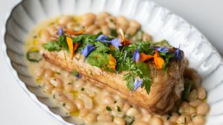 Monkfish tail topped with edible flowers