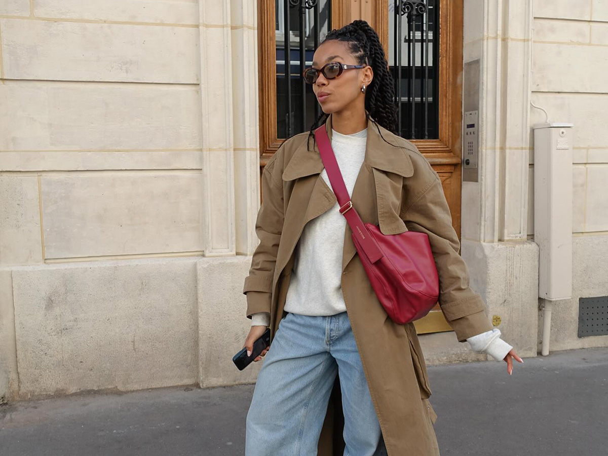 Woman wearing a trench coat in Paris.
