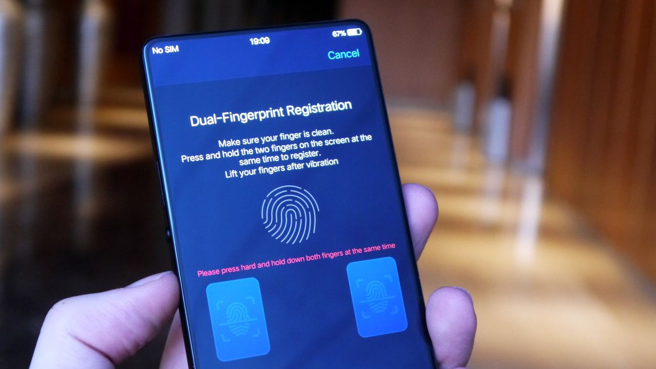 Holding a finger on each of the blue on-screen pads will register your dual-fingerprint