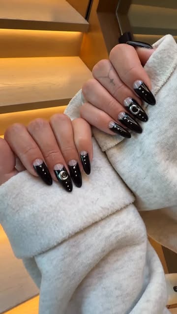 black nails with silver moon nail art