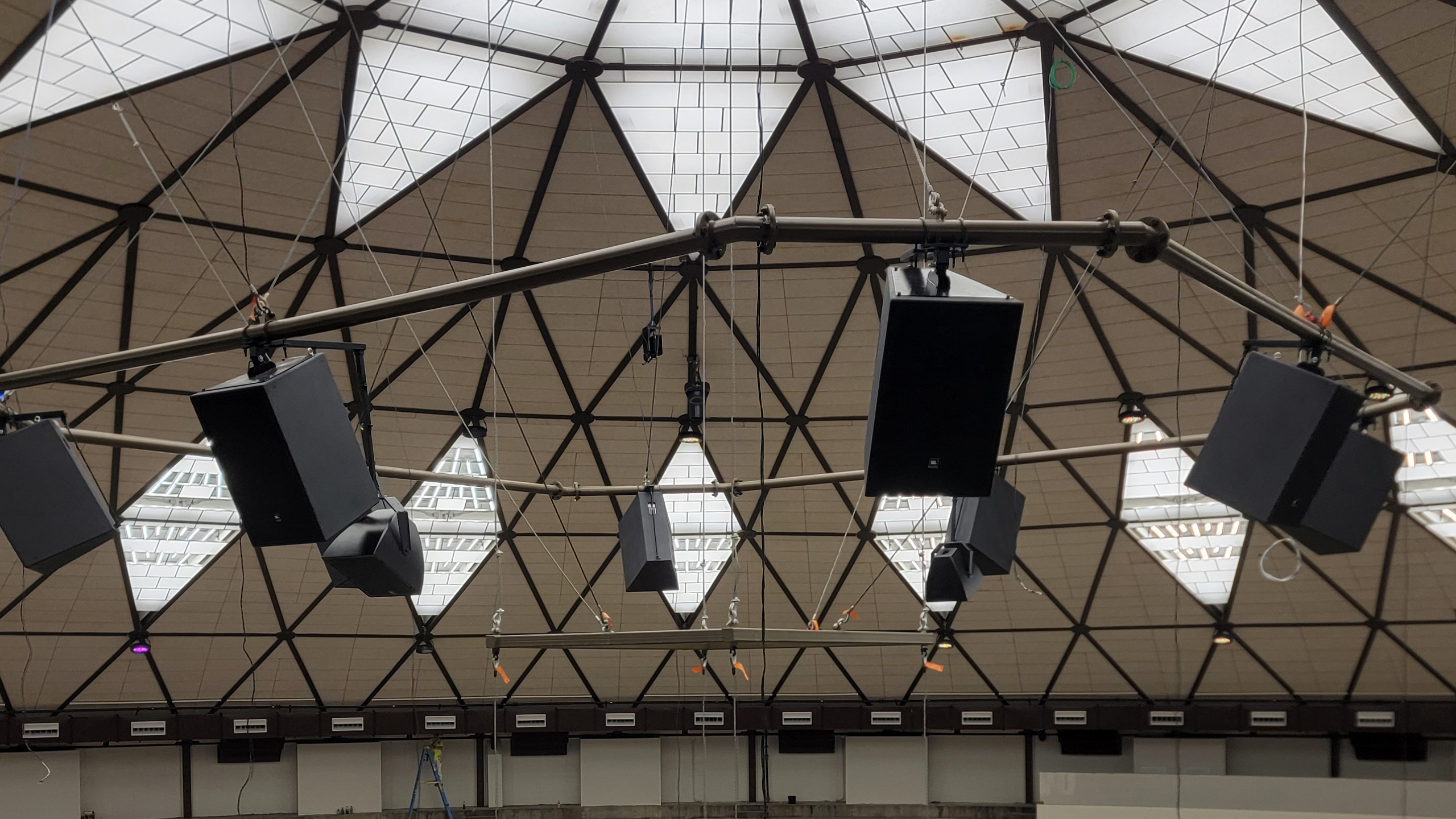 The domed ceiling of Dobyns-Bennett Gymnasium donned with JBL loudspeakers. 