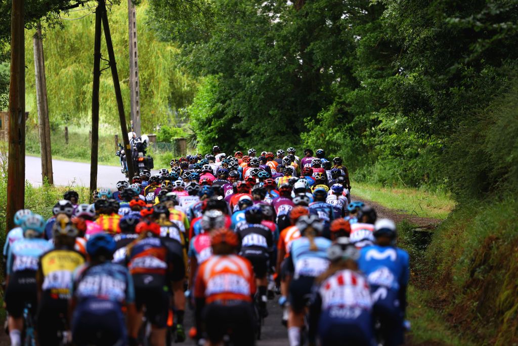 LANDERNEAU FRANCE JUNE 26 The Peloton passing through a Forest during the 8th La Course By Le Tour De France 2021 a 1077km race from Brest to Landerneau Cte De La Fosse Aux Loups 176m LaCourse LeTour TDF2021 UCIWWT on June 26 2021 in Landerneau France Photo by Tim de WaeleGetty Images