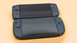 Lenovo Legion Go 2 and original Legion Go lying on their backs with their screens off. 