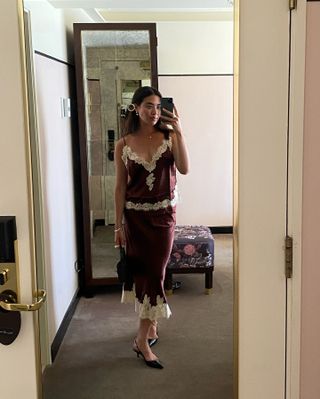 woman in silk set and pointed-toe pumps