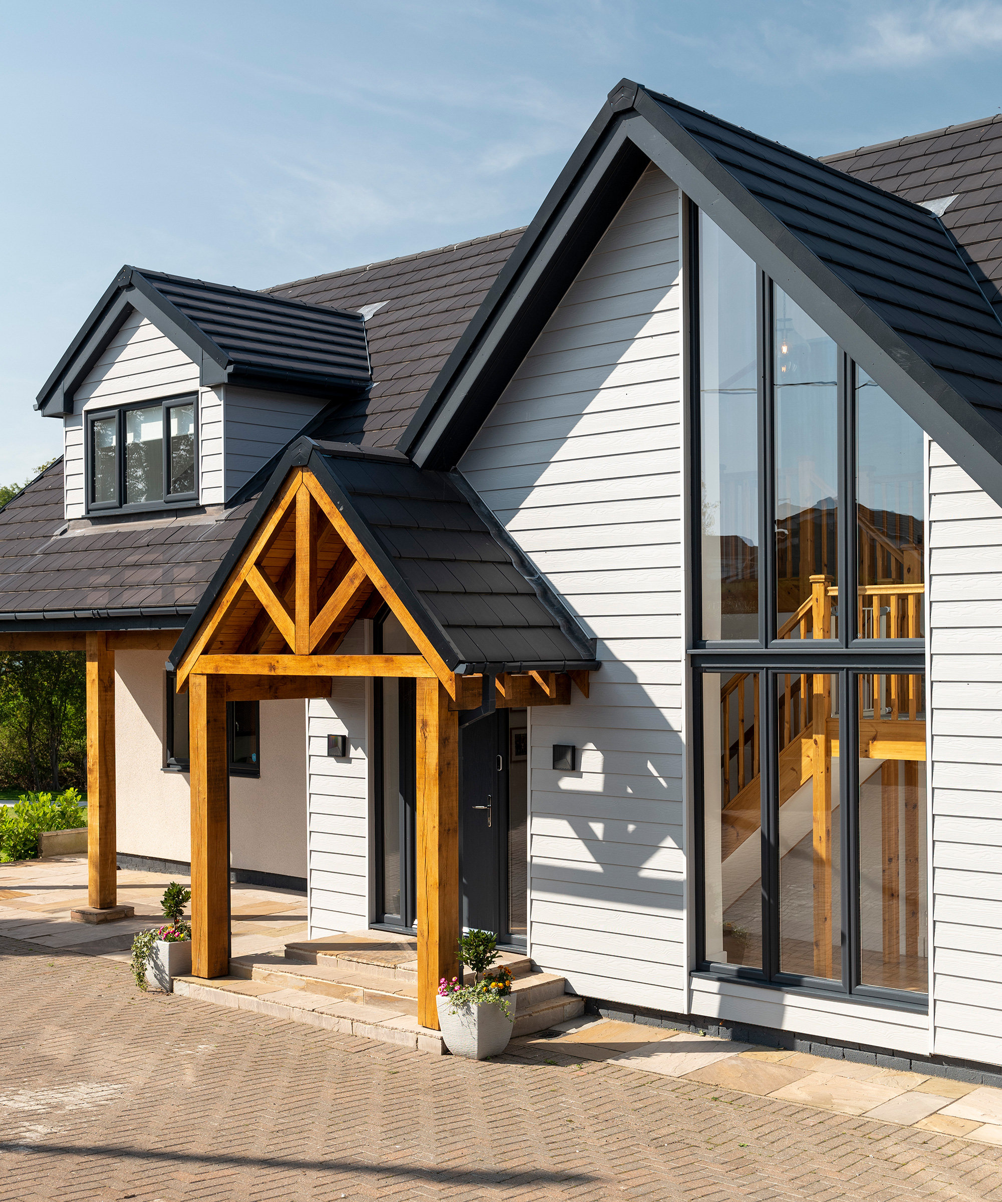 contemporary self build with oak frame porch