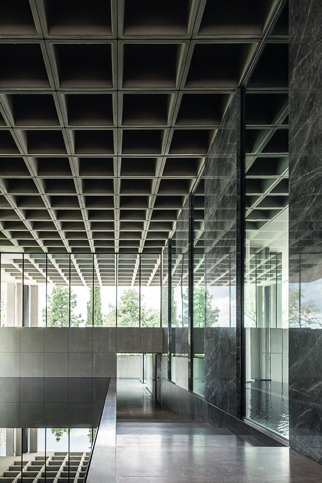 Greek brutalist gem AGET Iraklis by Alexandros Tombazis redesigned by Georges Batzios, clean concrete and marble and stone surfaces and shapes