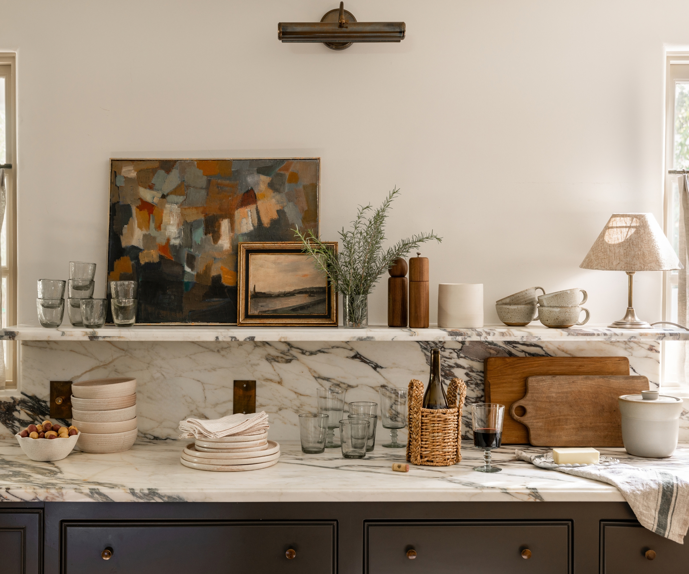 A corner of a classic kitchen decorated for fall with earthy colors and natural textures