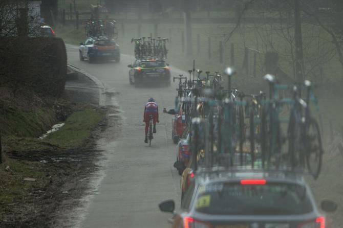 A lone rider tries to make it back to the bunch after having a mechanical.