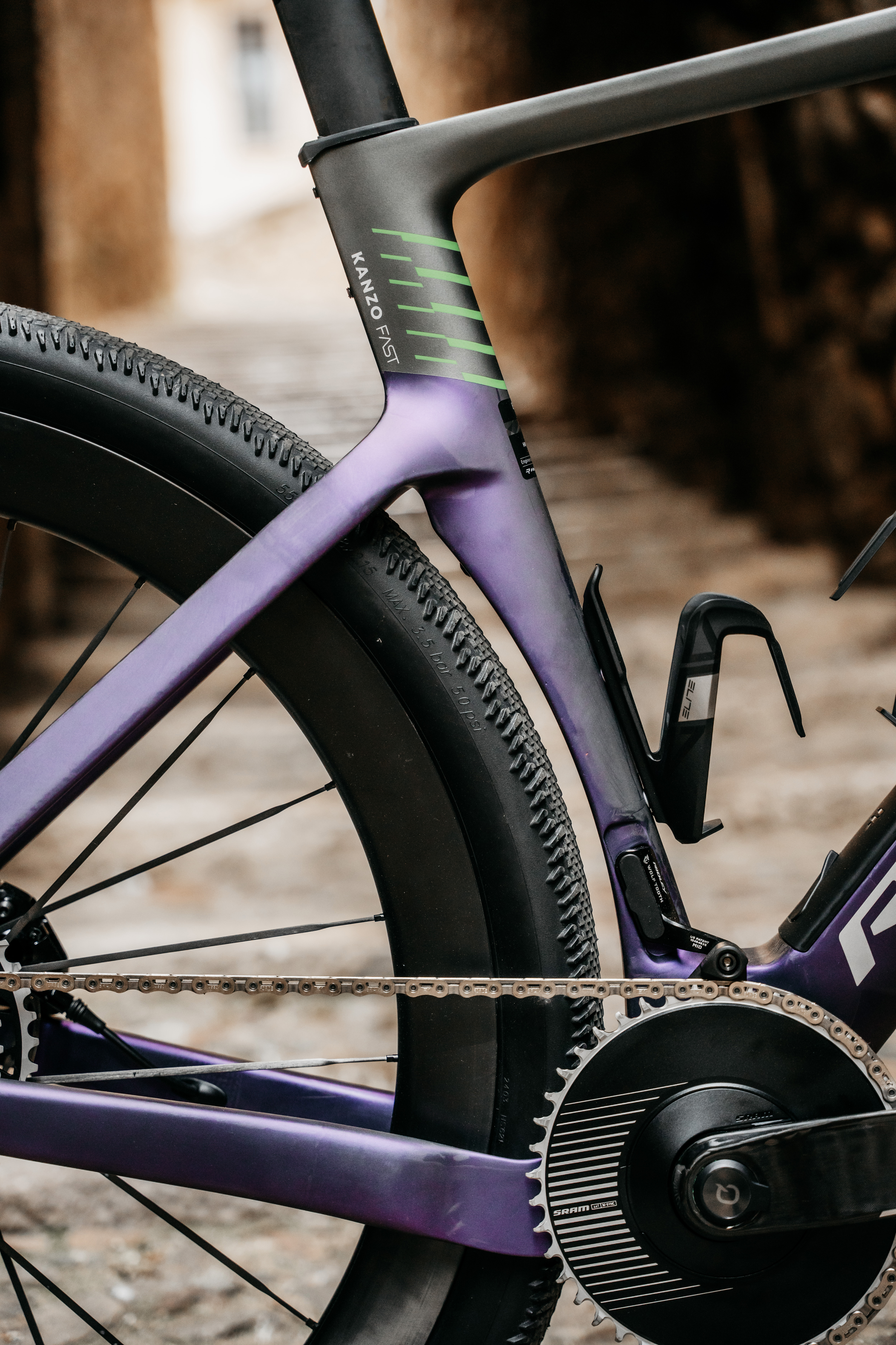 The seat tube of a purple and green Kanzo Fast 2.0