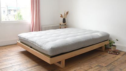 A futon mattress from the Futon Company in a modern bedroom