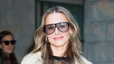 Kristen Bell wearing trench coat on October 23, 2025