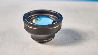 A photo of a ShiftCam LensUltra iPhone lens in black