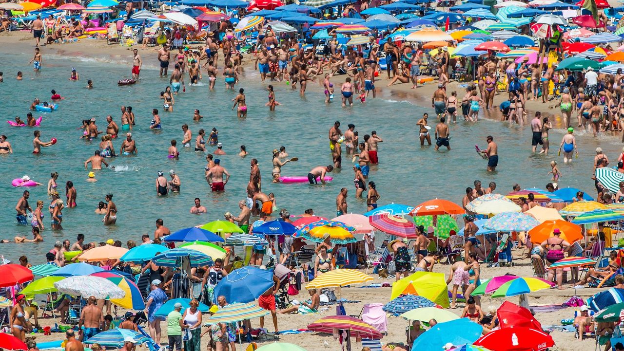 Sunbathers in Benidorm, Spain, before the Covid-19 outbreak