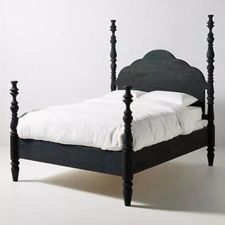 black ornate four poster bed from anthropologie
