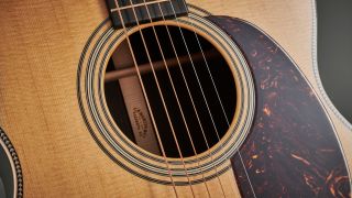 Ultra close up of the sound hole on a Martin 000-28 Modern Deluxe acoustic guitar