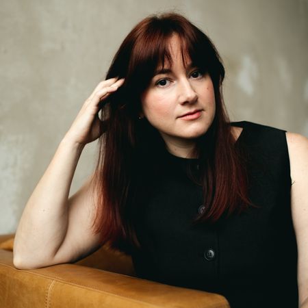 a portrait of Tyler McCall wearing a black waistcoat with buttons