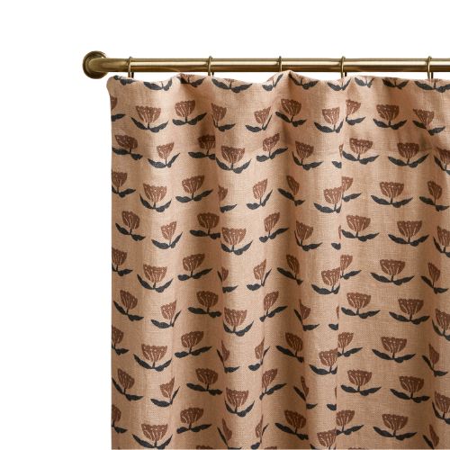 Floral patterned curtains on a gold pole
