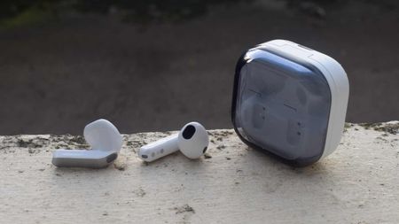 The Samsung Galaxy Buds 4 case and buds on a ledge.