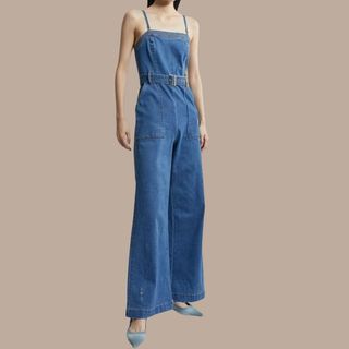 Flat lay image of woman in denim jumpsuit