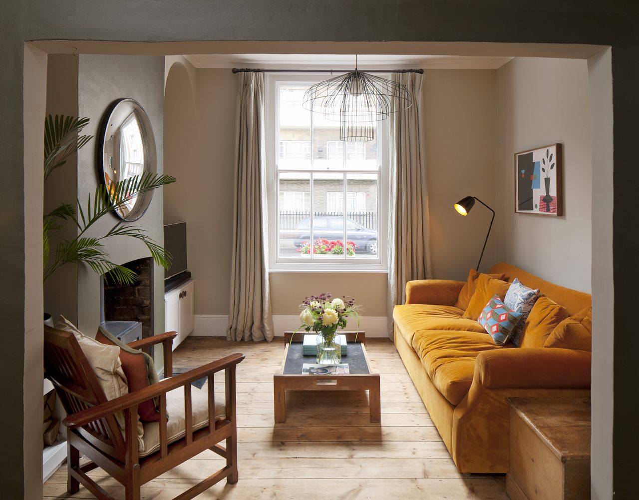living room with orange soft in renovated house