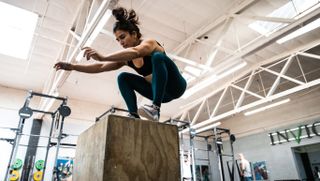 CrossFit athlete Lauren Fisher jumps onto plyo box