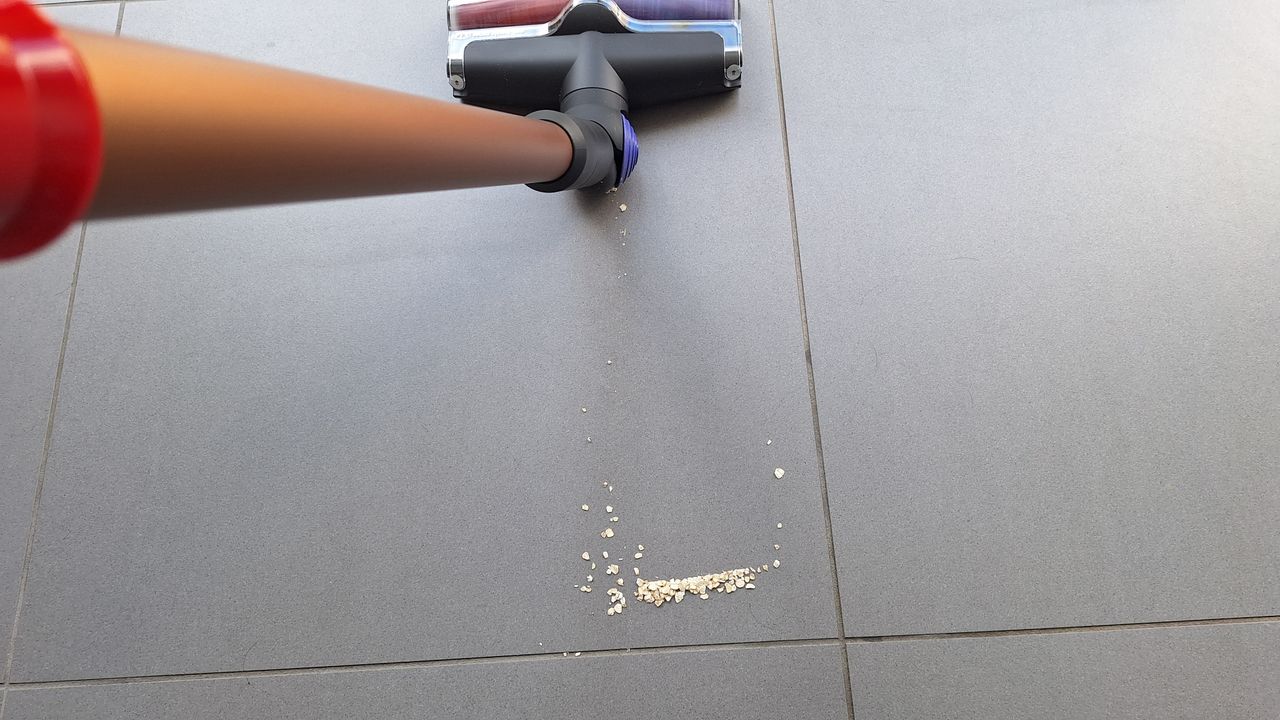 Dyson V16 during suction tests on a tiled floor