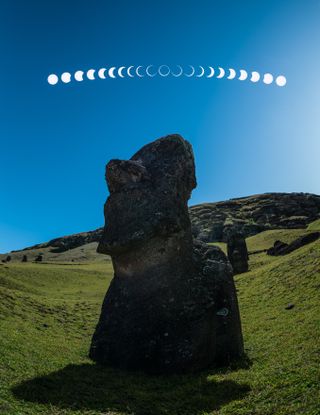 a composite image showing the sequence of the annular solar eclipse in the sky over a large moai statue.