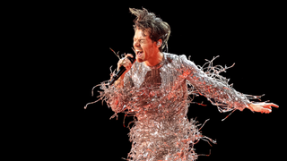 Harry Styles performing at the 65th Grammy Awards in a sparkly outfit