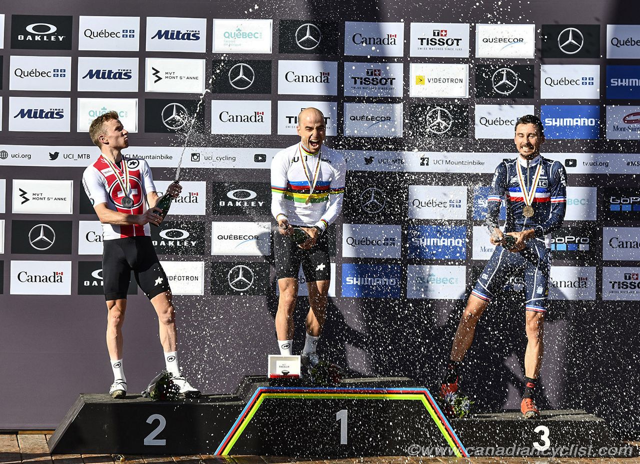Champagne flows on the podium