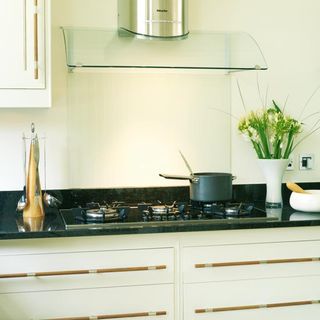 white modular kitchen with black countertop