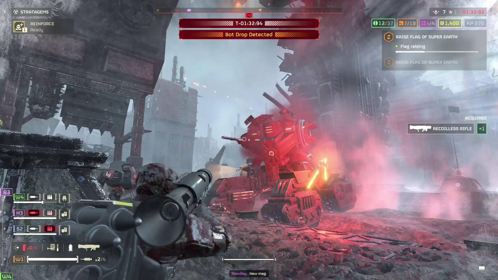 Helldivers 2 helldiver preparing to fire rocket at Vox Engine with one of its laser cannons already destroyed