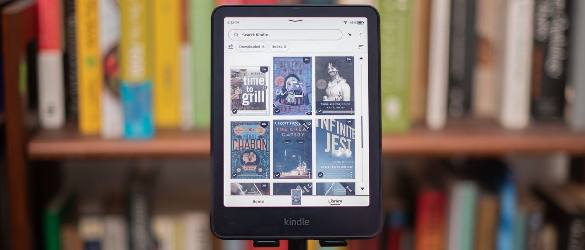 Amazon Kindle Colorsoft Signature edition e-reader showing graphic novels, cookbooks, and fiction, as well as settings