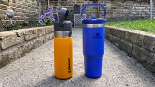 Two Stanley IceFlow Flip Straw Tumblers on an outdoor path