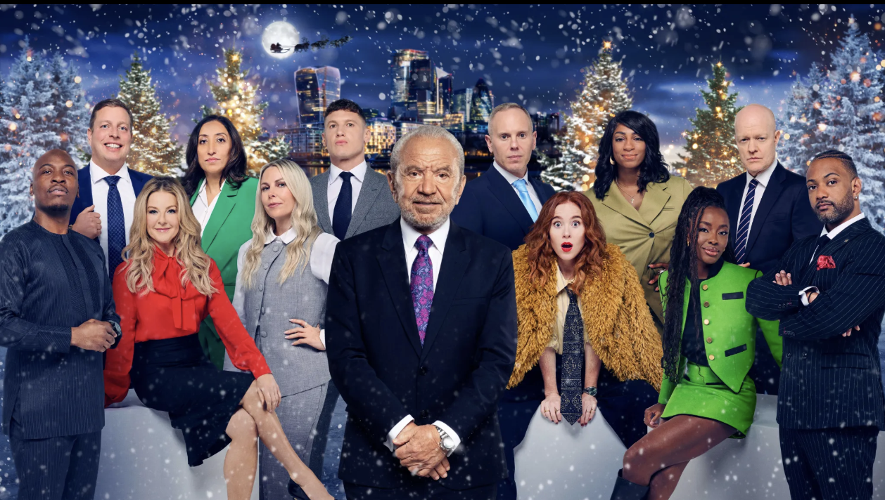 a promotional image showing the contestants against a christmassy skyline backdrop