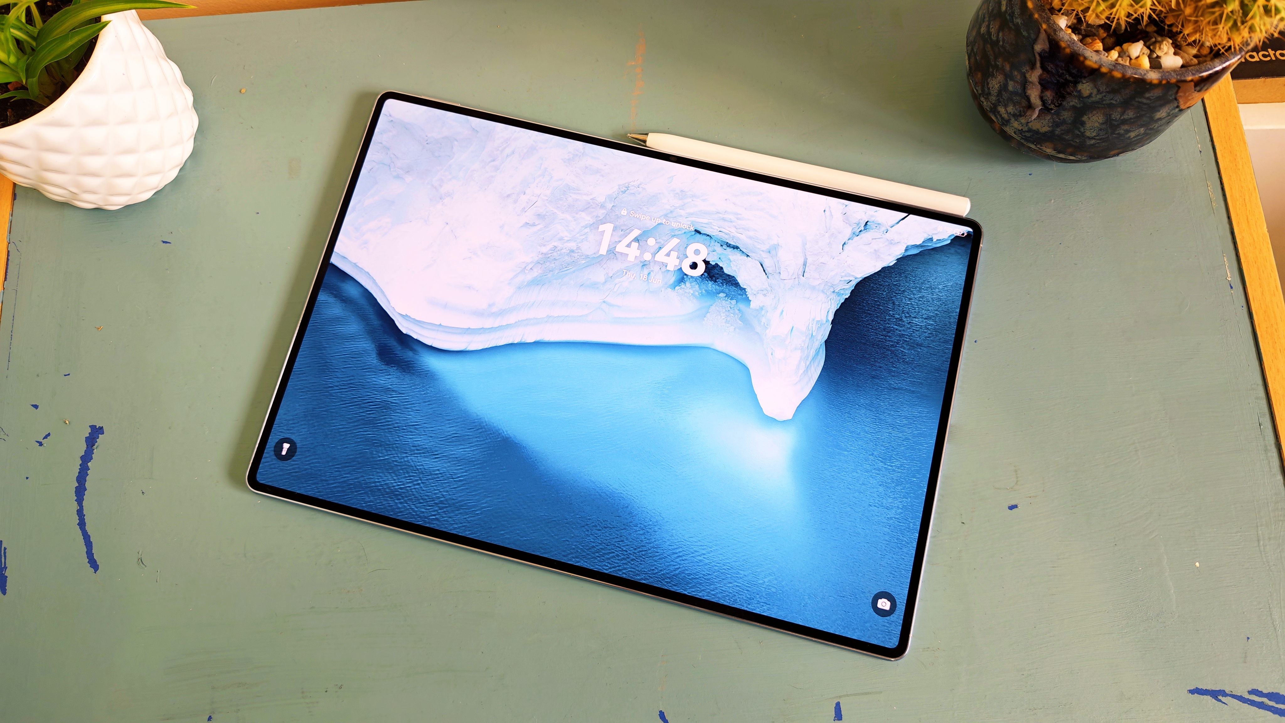 A Huawei MatePad Pro Max tablet on a blue-green table