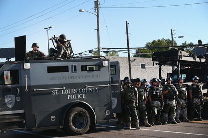 Obama is limiting federal provision of military armaments, like those used in Ferguson