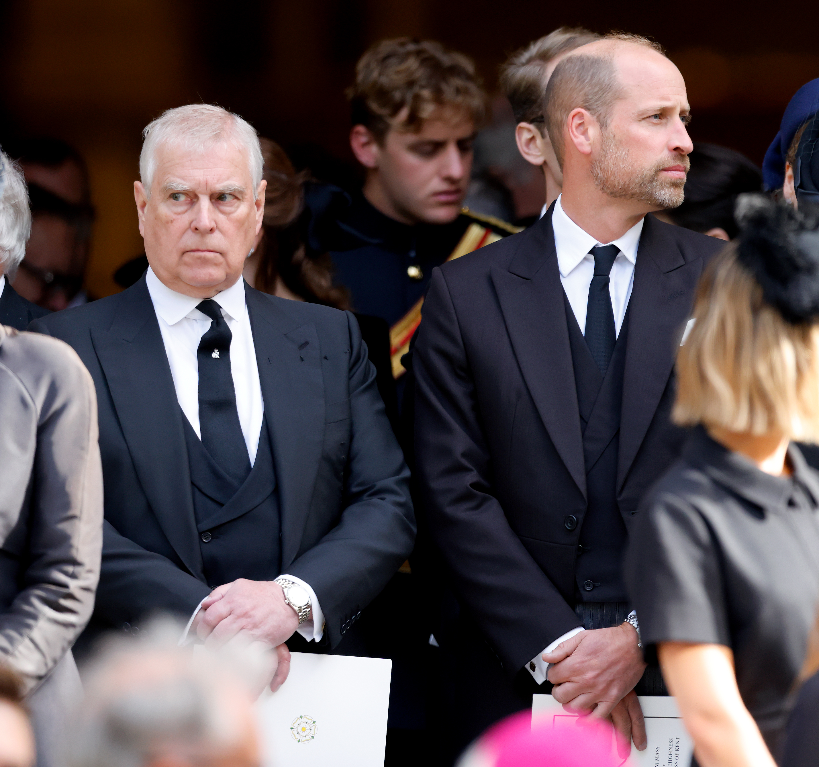 Prince Andrew and Prince William both wear black suits to attend a funeral