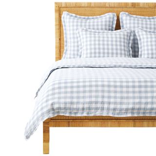 Pastel blue check gingham linen duvet cover on bed by Serena & Lily