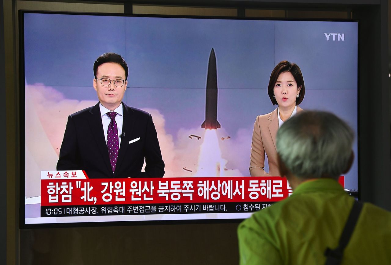 A man watches a television news screen reporting latest developments on North Korea&amp;#039;s missile launch as the screen shows file footage, at a railway station in Seoul on October 2, 2019. - Nort