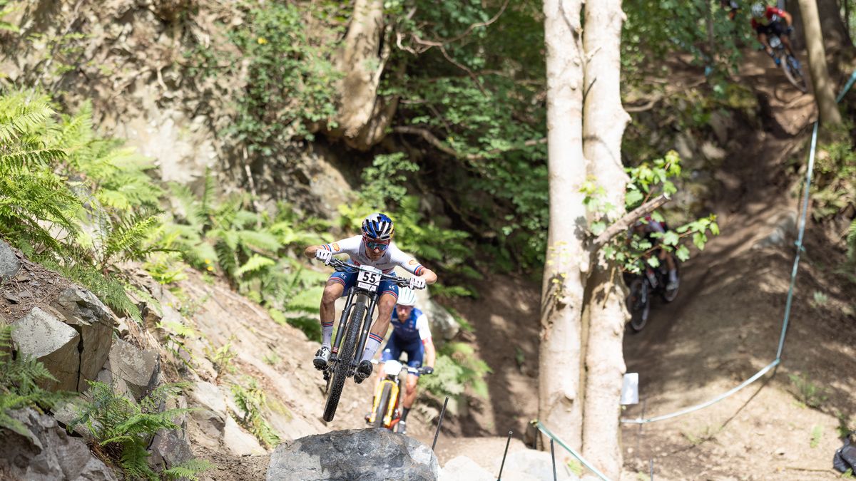 Tom Pidcock on one of the feature jumps at Glentress, Scotland