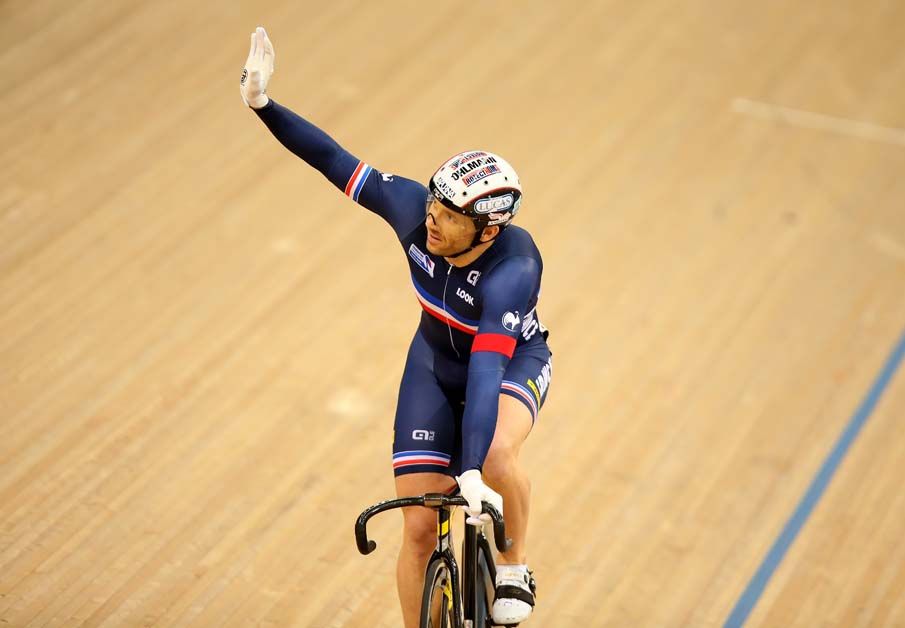 Francois Pervis waves to the crowd after making into the Keirin round 2