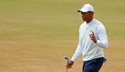 Tiger Woods waves to the crowd at The Open