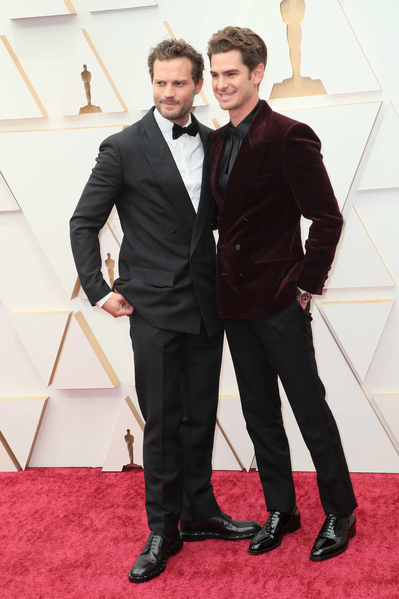 Jamie Dornan and Andrew Garfield posing on Oscars 2022 red carpet together