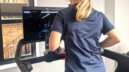 a photo of fitness editor Jane McGuire running on the Peloton Tread