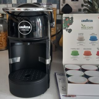 Lavazza Jolie coffee machine with a box of coffee pods