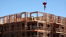 Workers build an apartment complex in Los Angeles