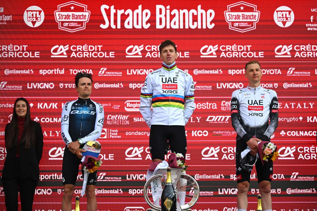SIENA ITALY MARCH 08 LR Tom Pidcock of The United Kingdom and Q365 Pro Cycling Team on second place race winner Tadej Pogacar of Slovenia and UAE Team EmiratesXRG and Tim Wellens of Belgium and UAE Team EmiratesXRG on third place pose on the podium ceremony after the 19th Strade Bianche 2025 Mens Elite a 213km one day race from Siena to Siena 320m UCIWT on March 08 2025 in Siena Italy Photo by Tim de WaeleGetty Images