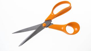 Scissors with orange handles