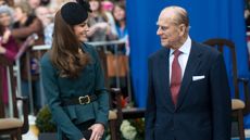 Catherine, Princess of Wales (L) and Prince Philip, Duke of Edinburgh smile during their visit to Leicester on March 8, 2012